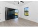 Light and bright bedroom with outside views from the sliding glass doors and a side window at 24294 Santa Inez Rd, Punta Gorda, FL 33955