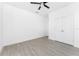 Bedroom featuring neutral paint, tile floors, recessed lights, ceiling fan and a double door closet at 24294 Santa Inez Rd, Punta Gorda, FL 33955