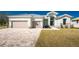 Charming home featuring a spacious driveway and attached two-car garage at 24294 Santa Inez Rd, Punta Gorda, FL 33955
