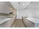 Contemporary kitchen boasts sleek countertops, stainless steel appliances, and modern cabinetry at 24294 Santa Inez Rd, Punta Gorda, FL 33955