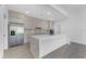 This spacious, modern kitchen has stainless steel appliances, quartz countertops and backsplash, and recessed lighting at 24294 Santa Inez Rd, Punta Gorda, FL 33955