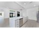 Bright, open kitchen showcases modern appliances, an island with sink, and plenty of counter space at 24294 Santa Inez Rd, Punta Gorda, FL 33955