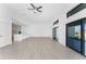 Open-concept living room with tile floors, a ceiling fan, recessed lights, and sliding glass doors to backyard at 24294 Santa Inez Rd, Punta Gorda, FL 33955