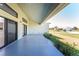 Covered patio with stained concrete floor, offering a seamless indoor-outdoor living experience at 24294 Santa Inez Rd, Punta Gorda, FL 33955