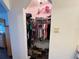 Walk-in closet featuring ample storage space with shelves and hanging racks at 25068 Harborview Rd # 3D, Punta Gorda, FL 33980