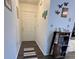 Welcoming entryway with dark floors and a decorative shelf and decor at 25068 Harborview Rd # 3D, Punta Gorda, FL 33980