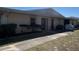 Inviting single-story villa with clean exterior and trimmed shrubs, offering a cozy curb appeal at 25068 Harborview Rd # 3D, Punta Gorda, FL 33980