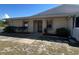 Charming single-story home featuring lush landscaping, a cozy entryway, and a well-maintained lawn at 25068 Harborview Rd # 3D, Punta Gorda, FL 33980