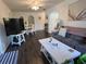 Cozy living room with modern furniture, wood floors, and bright natural light, perfect for relaxation at 25068 Harborview Rd # 3D, Punta Gorda, FL 33980