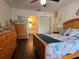 Comfortable bedroom highlighting wood floors and a closet at 25068 Harborview Rd # 3D, Punta Gorda, FL 33980
