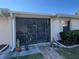 Enclosed patio with greenery and potted plants creates a relaxing outdoor space at 25068 Harborview Rd # 3D, Punta Gorda, FL 33980