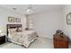 Serene bedroom with floral bedding and tiled flooring at 25559 Heritage Lake Blvd # 25, Punta Gorda, FL 33983