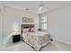 Relaxing bedroom with a ceiling fan and simple decor at 25559 Heritage Lake Blvd # 25, Punta Gorda, FL 33983