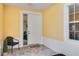 Cozy entrance featuring tiled flooring, a comfortable chair, and a bright window at 25559 Heritage Lake Blvd # 25, Punta Gorda, FL 33983