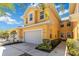 Charming two-story home with a well-maintained lawn, a two-car garage, and beautiful landscaping at 25559 Heritage Lake Blvd # 25, Punta Gorda, FL 33983