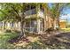 Charming exterior view featuring a screened lanai and an upper balcony at 25559 Heritage Lake Blvd # 25, Punta Gorda, FL 33983