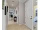 Elegant foyer with neutral walls, tiled flooring, and decorative artwork creating a welcoming entrance at 25559 Heritage Lake Blvd # 25, Punta Gorda, FL 33983