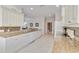 Well-equipped kitchen with granite countertops, white cabinetry, and mosaic tile backsplash offering ample space at 25559 Heritage Lake Blvd # 25, Punta Gorda, FL 33983
