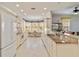 Spacious kitchen with white cabinets, granite countertops, and a breakfast nook with bay windows at 25559 Heritage Lake Blvd # 25, Punta Gorda, FL 33983