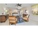 Bright living room with ceiling fans and open floor plan at 25559 Heritage Lake Blvd # 25, Punta Gorda, FL 33983