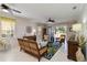 Bright and airy living room featuring comfortable furniture and a scenic lake view for relaxation at 25559 Heritage Lake Blvd # 25, Punta Gorda, FL 33983