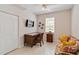 Comfortable office space featuring a woven desk and a daybed at 25559 Heritage Lake Blvd # 25, Punta Gorda, FL 33983