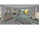 This bright bedroom features a large dresser and a window offering outside views at 3106 Heron Shores Dr, Venice, FL 34293