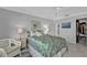 Cozy bedroom with a walk-in closet, and coastal inspired decor and artwork at 3106 Heron Shores Dr, Venice, FL 34293