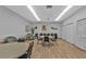 Inviting community room with neutral colors, round tables, cozy seating, and large closets at 3106 Heron Shores Dr, Venice, FL 34293