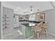Charming kitchen featuring a breakfast bar, modern appliances, and lots of countertop space at 3106 Heron Shores Dr, Venice, FL 34293