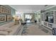 Large living room is furnished with comfortable sofa, coastal decor, and ceiling fan at 3106 Heron Shores Dr, Venice, FL 34293