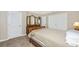 Bedroom with tile floors and a wooden bed and neutral colors at 3123 David St, Punta Gorda, FL 33982