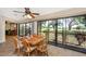 Bright dining room with wood table, chairs, and a beautiful view through large windows at 3123 David St, Punta Gorda, FL 33982
