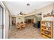 A sunroom featuring a dining area and a living room with view of the back yard at 3123 David St, Punta Gorda, FL 33982