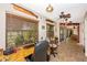 Office with a large window overlooking the backyard and a wooden desk at 3123 David St, Punta Gorda, FL 33982