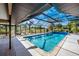 Inviting screened-in pool with clear blue water and ample deck space, perfect for relaxation at 3123 David St, Punta Gorda, FL 33982