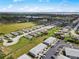 Aerial view of the community showcasing residential areas, green spaces, and convenient parking at 3310 Loveland Blvd # 1102, Punta Gorda, FL 33980