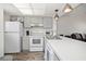 Well-lit kitchen featuring modern appliances and a seamless flow into the living space at 3310 Loveland Blvd # 1102, Punta Gorda, FL 33980