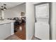Laundry area shows an in-unit stacked washer and dryer; living area is visible in the background at 3310 Loveland Blvd # 1102, Punta Gorda, FL 33980