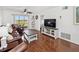 Comfortable living room with a sliding glass door leading to a screened-in porch and beautiful views at 3310 Loveland Blvd # 1102, Punta Gorda, FL 33980