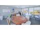 Community meeting room with tables, chairs, and bookshelves, ideal for gatherings and activities at 3310 Loveland Blvd # 1102, Punta Gorda, FL 33980