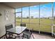 Screened patio with dining table and chairs offers views of backyard, open space, and neighborhood at 3310 Loveland Blvd # 1102, Punta Gorda, FL 33980