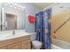 The bathroom features a single sink vanity and a tub with shower at 402 Cicero Nw St, Port Charlotte, FL 33948