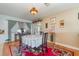 Charming dining area with a round table, elegant décor, and hardwood flooring at 402 Cicero Nw St, Port Charlotte, FL 33948