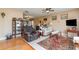 Cozy living room featuring comfortable seating, hardwood floors, and tasteful décor at 402 Cicero Nw St, Port Charlotte, FL 33948