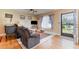 Inviting living room with hardwood floors, neutral walls, and natural light from the window at 402 Cicero Nw St, Port Charlotte, FL 33948