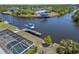 Aerial view of the property highlighting a waterfront location, boat dock, and lush surroundings at 4146 Library St, Port Charlotte, FL 33948