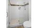 Modern bathroom featuring a white subway tile shower with a glass enclosure and updated fixtures at 4146 Library St, Port Charlotte, FL 33948