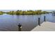 Private dock on a serene waterway, perfect for boating, fishing, and enjoying waterfront living at 4146 Library St, Port Charlotte, FL 33948