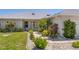 Charming home featuring a well-manicured lawn, tasteful landscaping, and a welcoming entrance at 4146 Library St, Port Charlotte, FL 33948